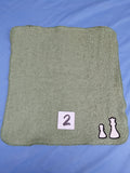 Sage green embellished washcloth with two chess pieces, reinforced hem