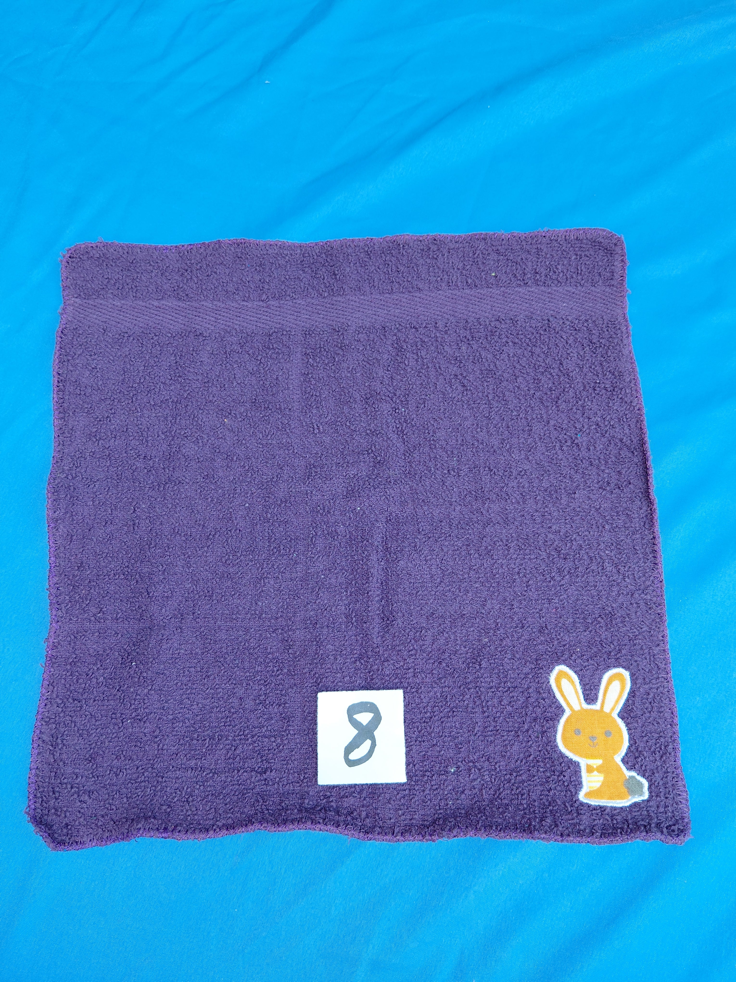 Deep purple embellished washcloth with bunny, reinforced hem