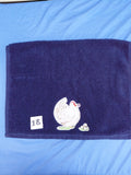 Dark blue embellished hand towel with hen and three eggs, reinforced hem