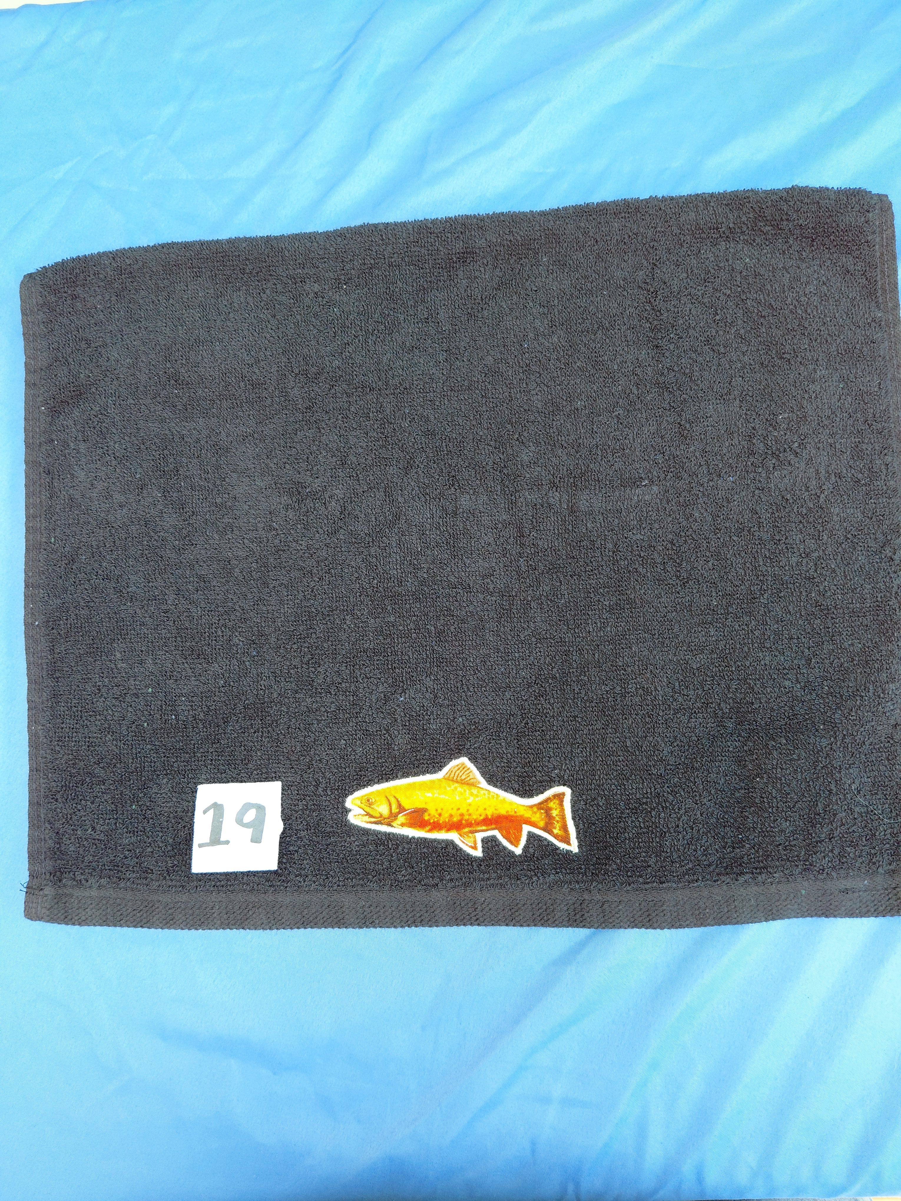 Black embellished hand towel with trout, reinforced hem