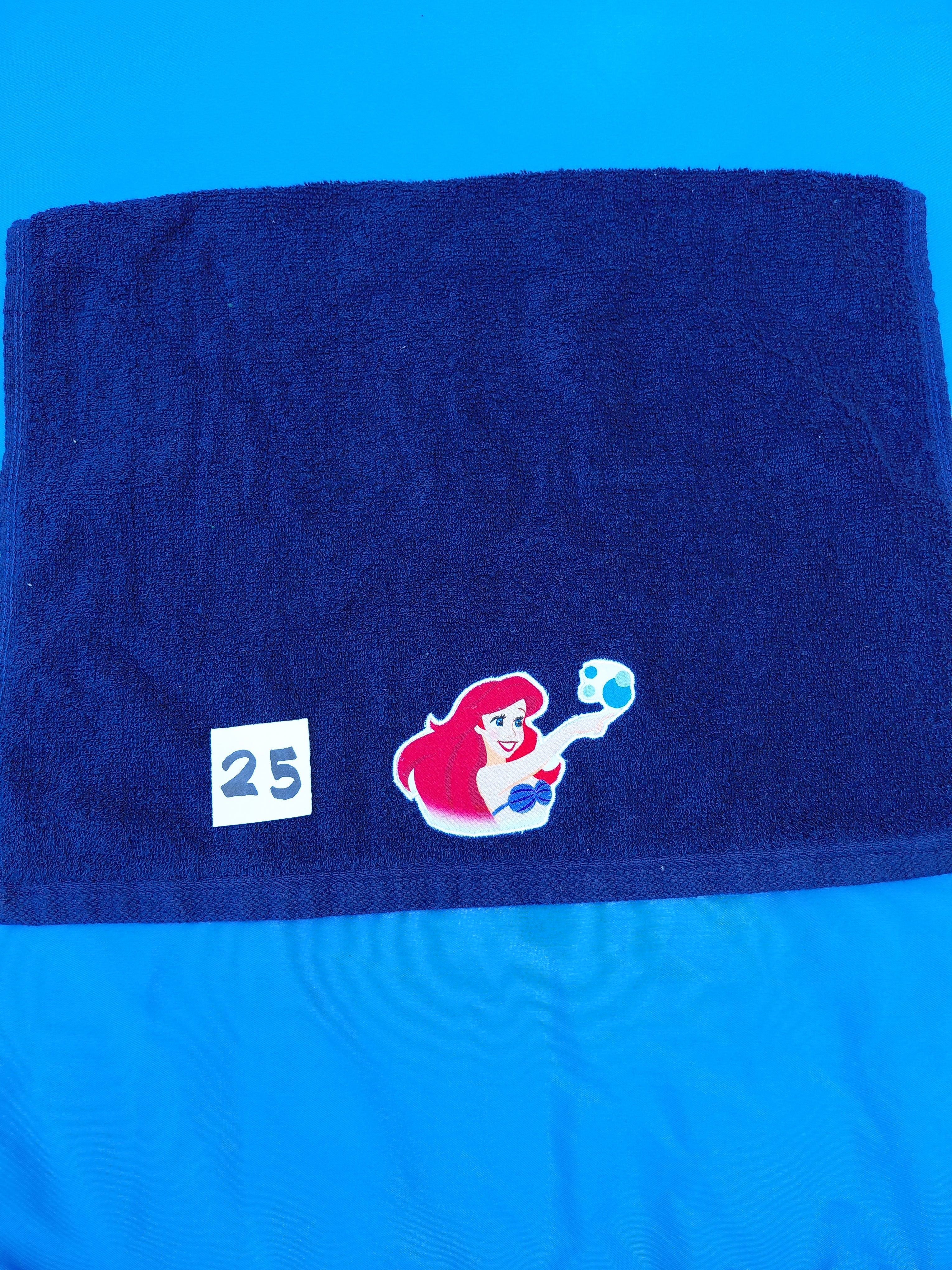 Dark blue handcrafted embellished hand towel with princess appliqué, reinforced hem