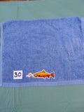 Sky blue embellished hand towel with trout about to bite a lure, reinforced hem
