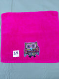 Magenta handcrafted embellished hand towel with sky blue outlined owl appliqué, reinforced hem