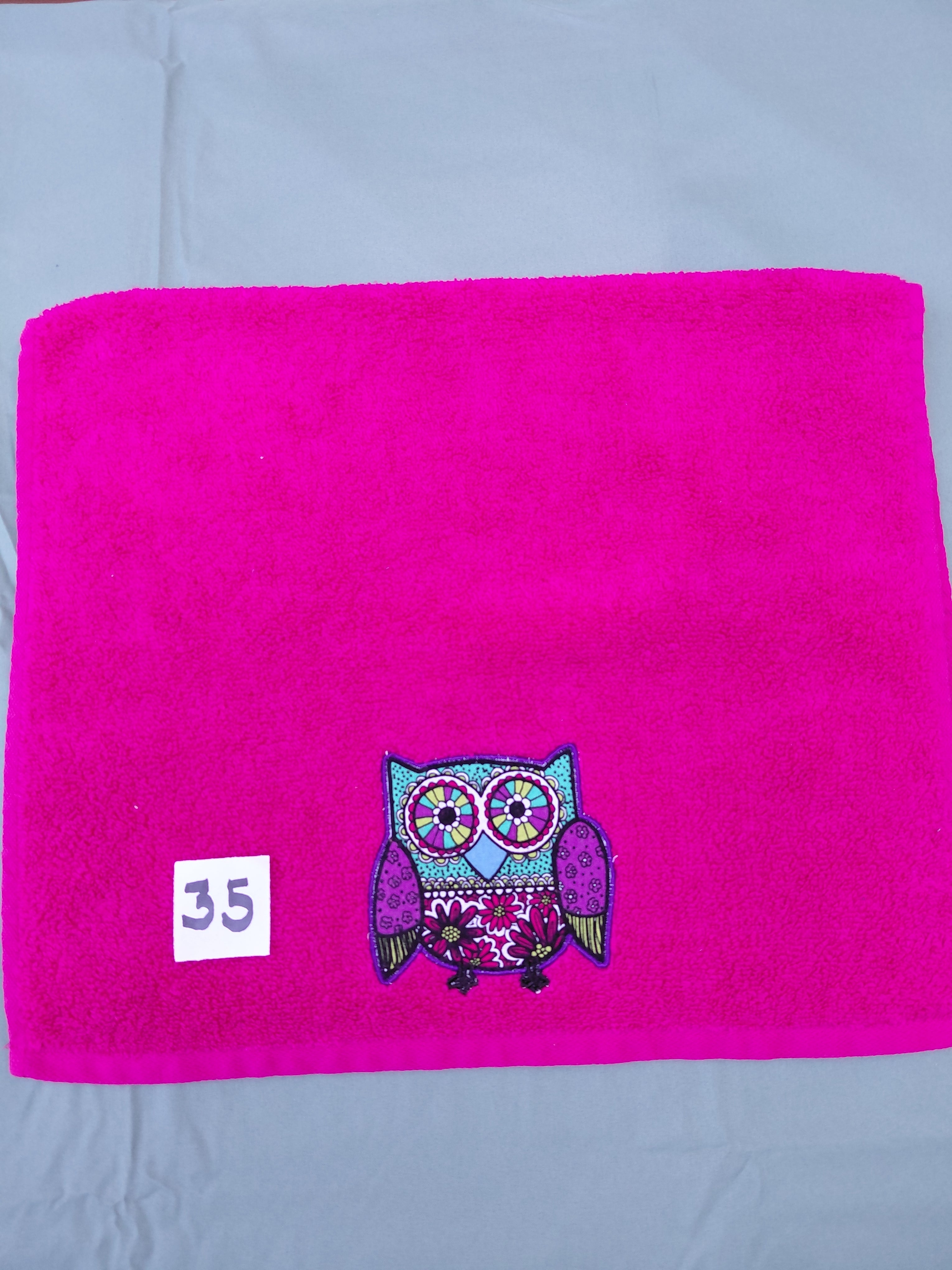 Magenta handcrafted embellished hand towel with deep purple outlined owl appliqué, reinforced hem