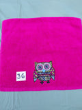 Magenta handcrafted embellished hand towel with bright red outlined owl appliqué, reinforced hem