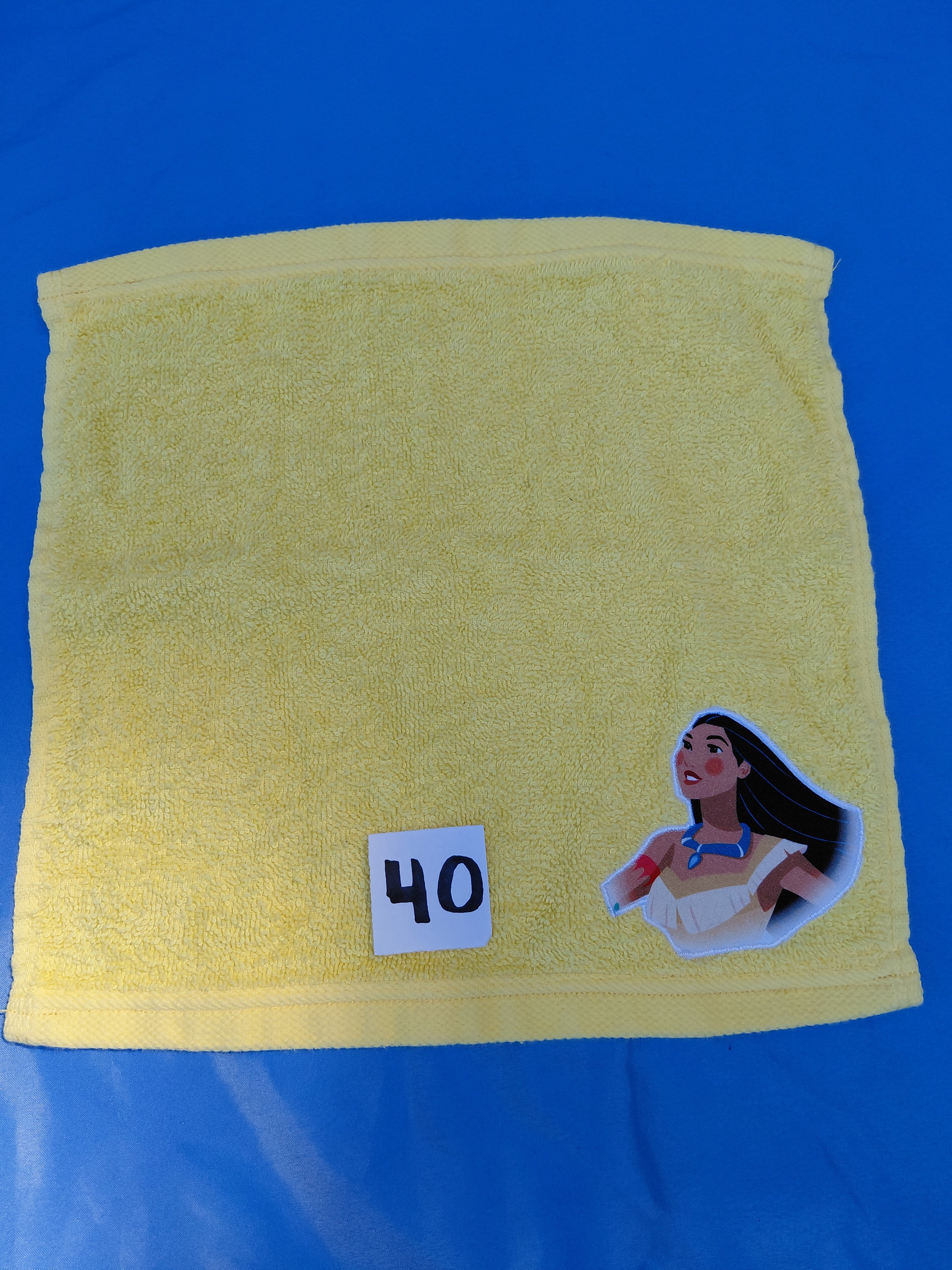 Lemon yellow handcrafted embellished washcloth with princess appliqué, reinforced hem