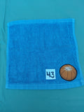 Sky blue handcrafted embellished washcloth with basketball appliqué, reinforced hem