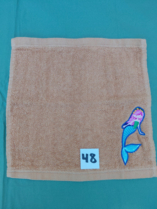 Burnt orange handcrafted embellished washcloth with mermaid appliqué, reinforced hem