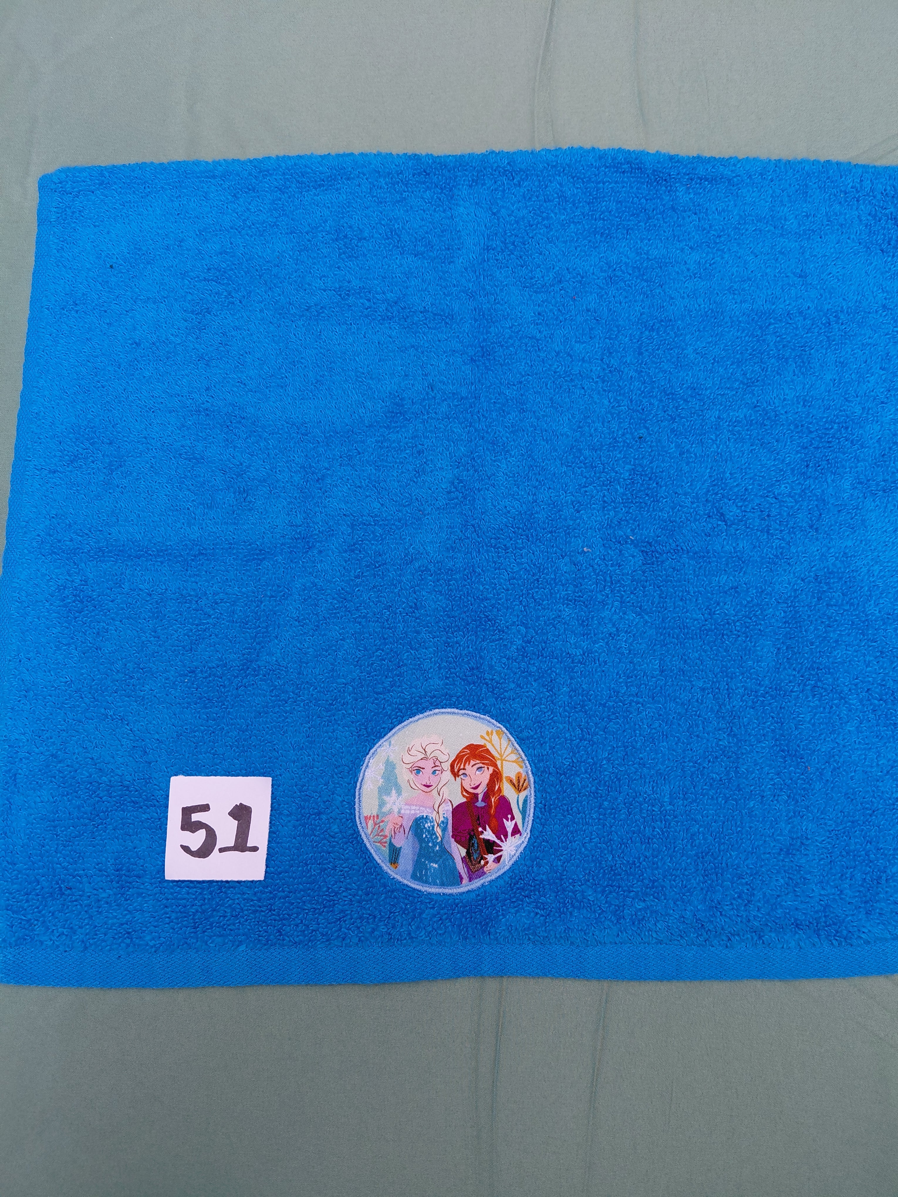 Aqua handcrafted embellished hand towel with two princesses appliqué, reinforced hem