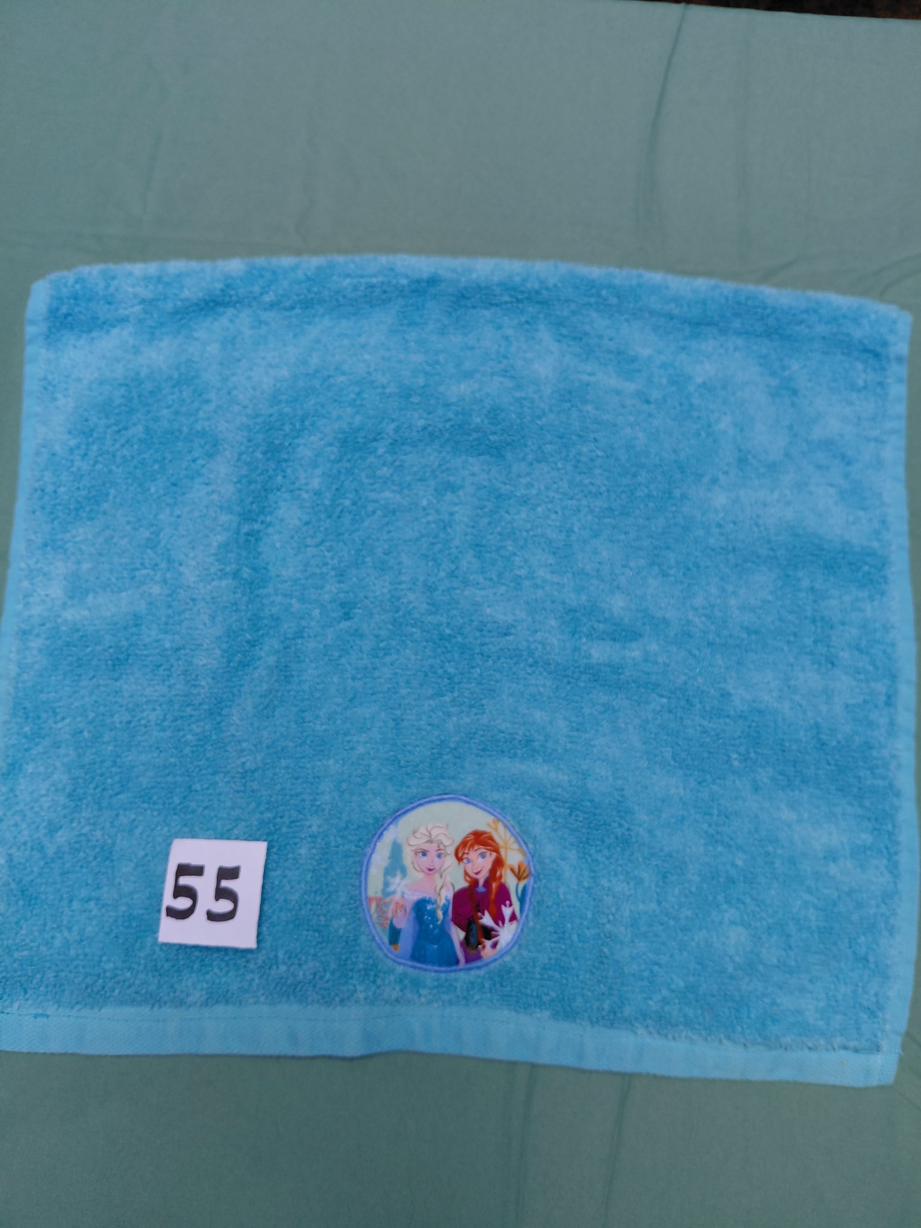 Minty aqua handcrafted embellished hand towel with two princesses appliqué, reinforced hem