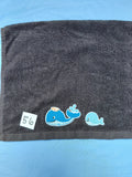 Black handcrafted embellished hand towel with two whales appliqué, reinforced hem