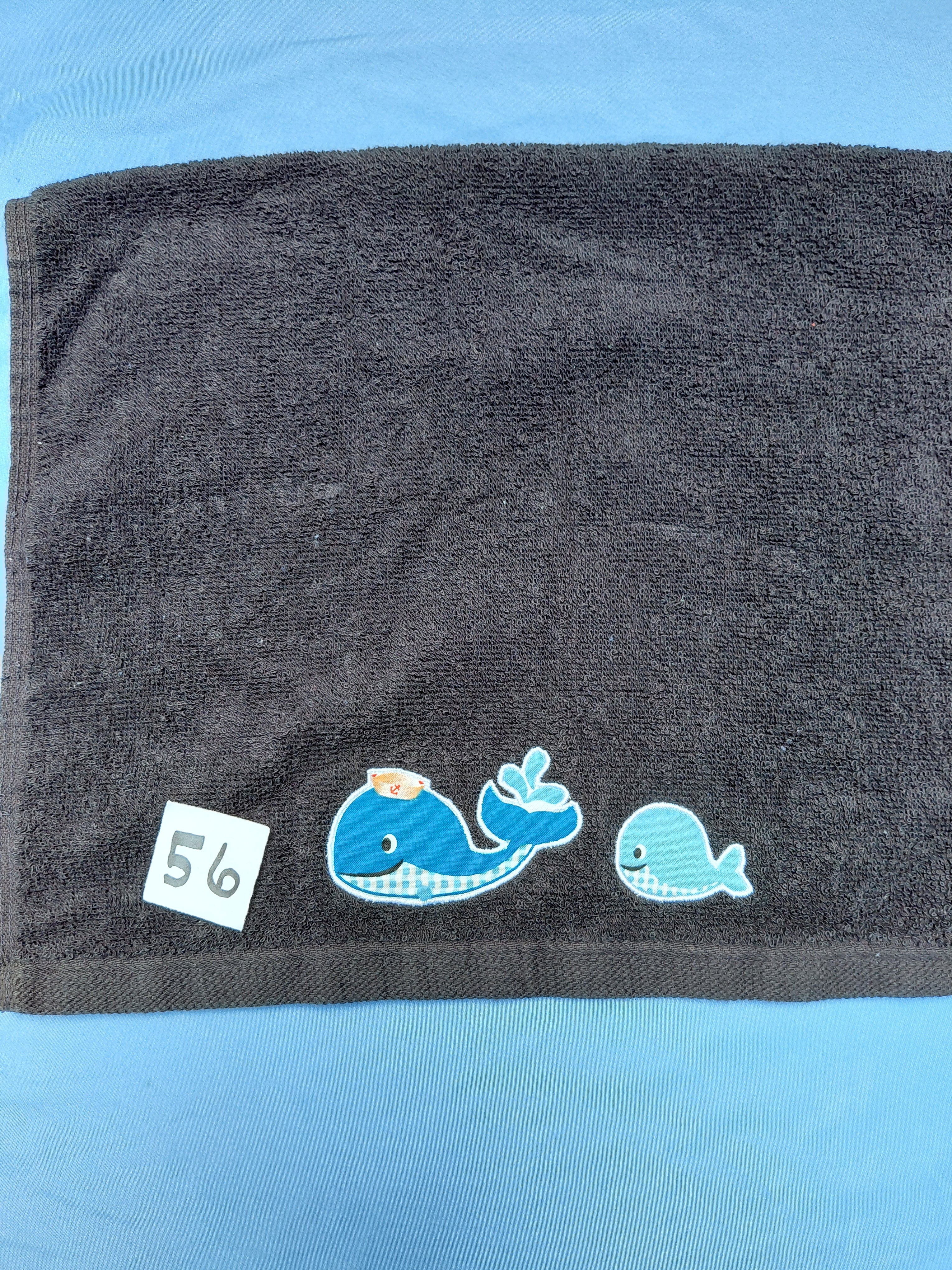 Black handcrafted embellished hand towel with two whales appliqué, reinforced hem