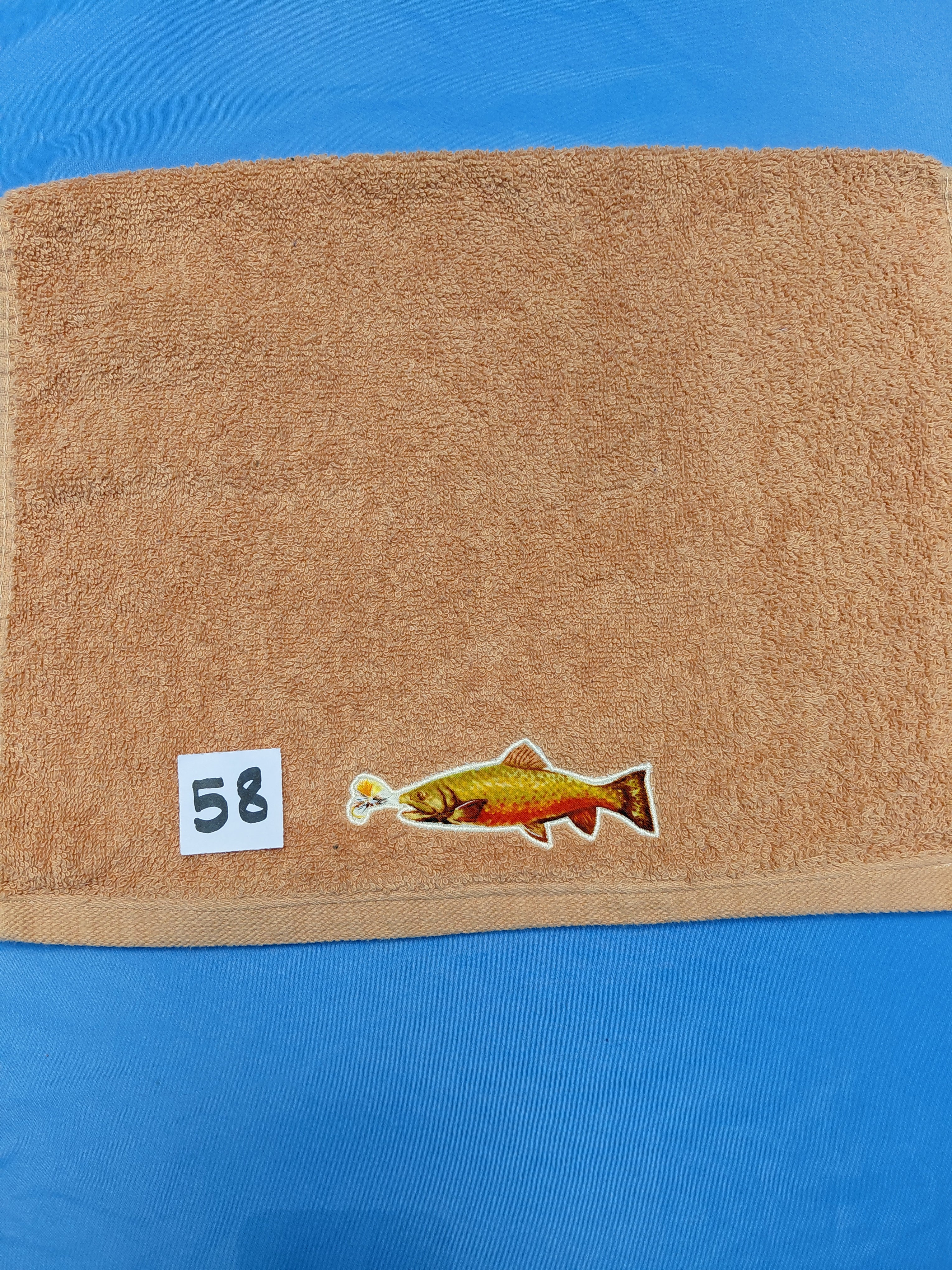Burnt orange handcrafted embellished hand towel with trout appliqué, reinforced hem