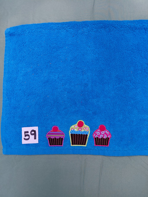 Aqua handcrafted embellished hand towel with three cupcakes appliqué, reinforced hem
