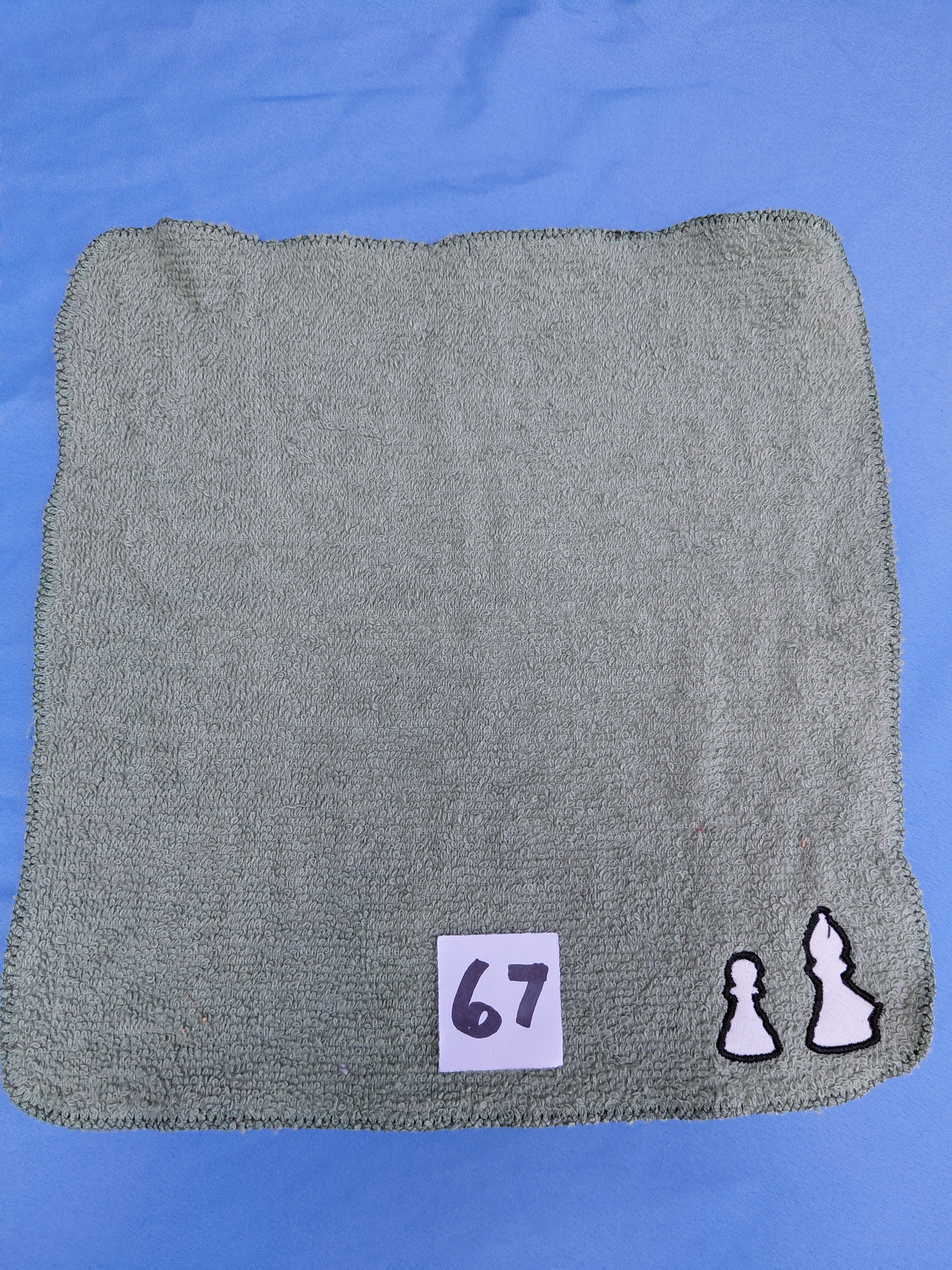 Stormy sky gray handcrafted embellished washcloth with chess pieces appliqué, reinforced hem