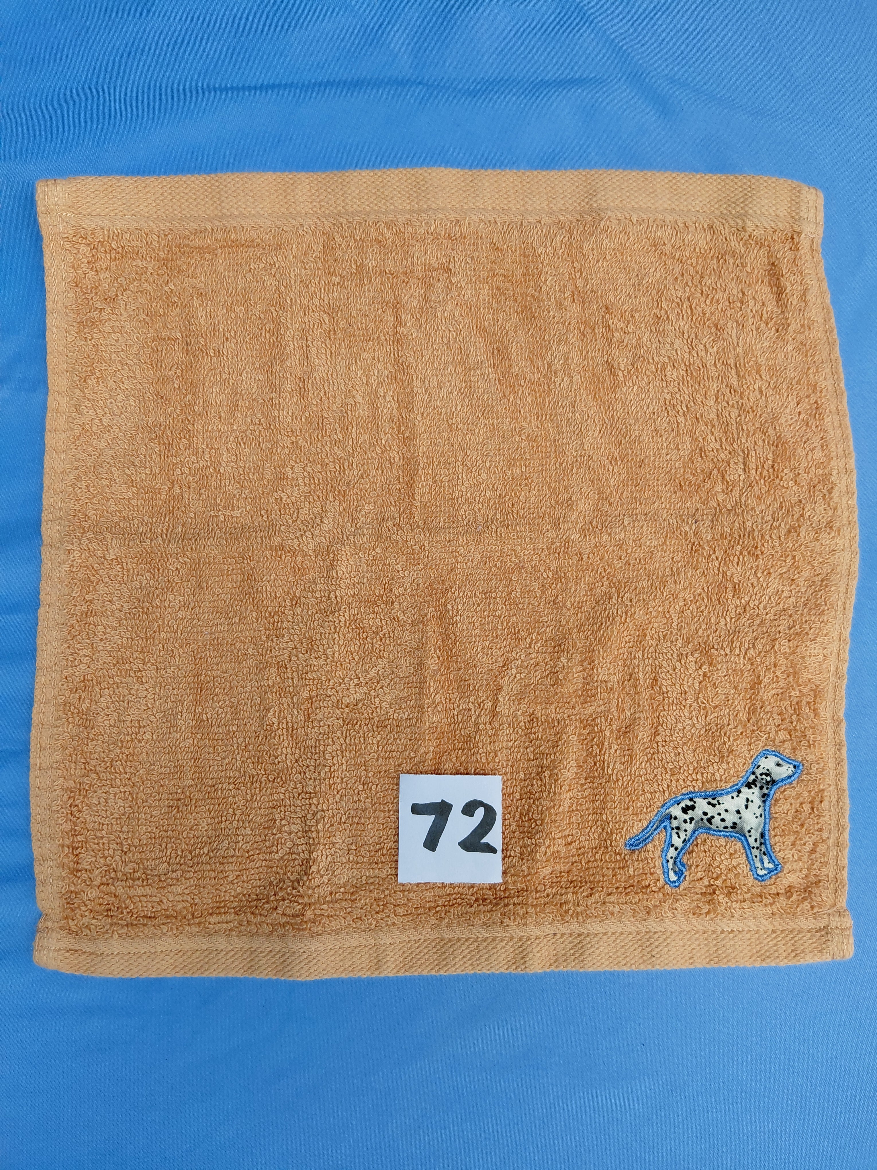 Burnt orange handcrafted embellished washcloth with dalmatian appliqué, reinforced hem

