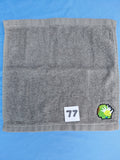 Stormy sky gray handcrafted embellished washcloth with dinosaur appliqué, reinforced hem