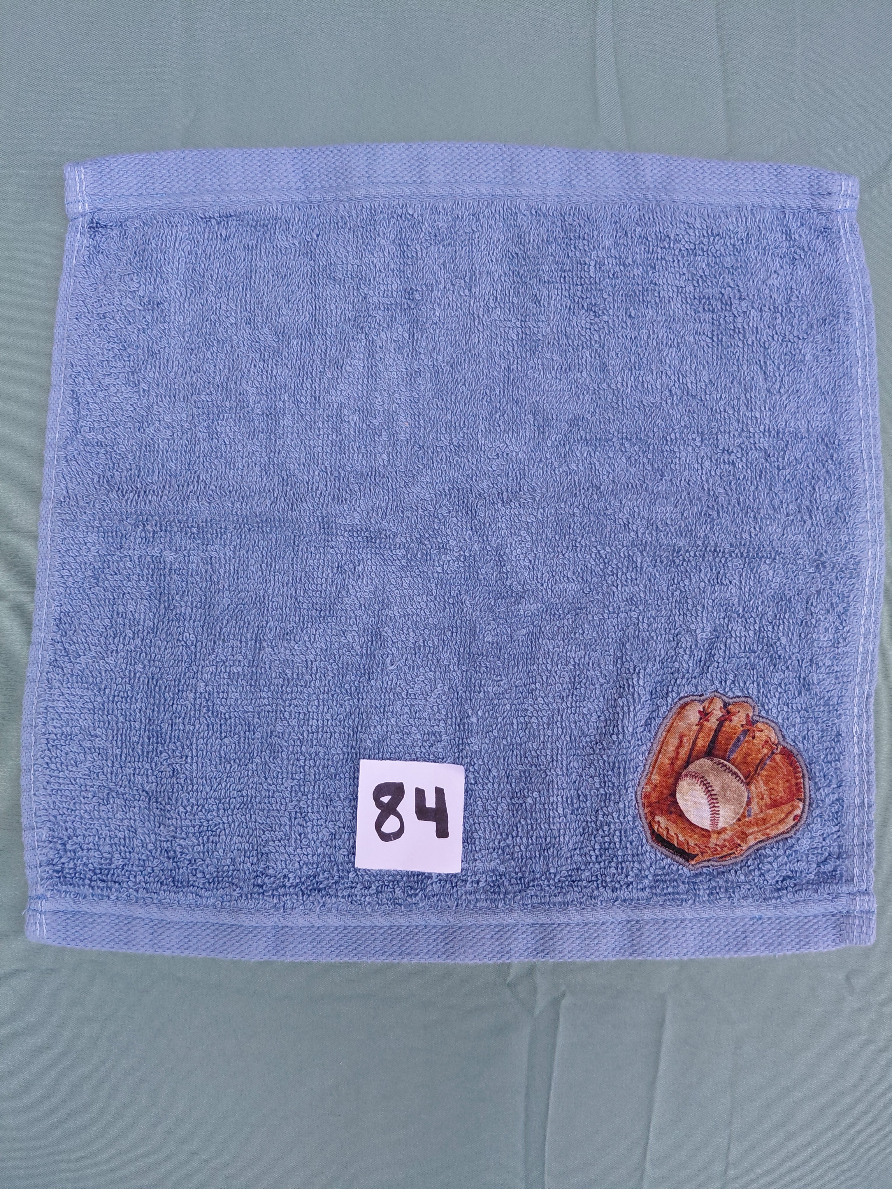 Sky blue handcrafted embellished washcloth with baseball glove and ball appliqué, reinforced hem