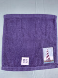 Dark blue handcrafted embellished washcloth with lighthouse appliqué, reinforced hem