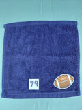 Dark blue handcrafted embellished washcloth with football appliqué, reinforced hem