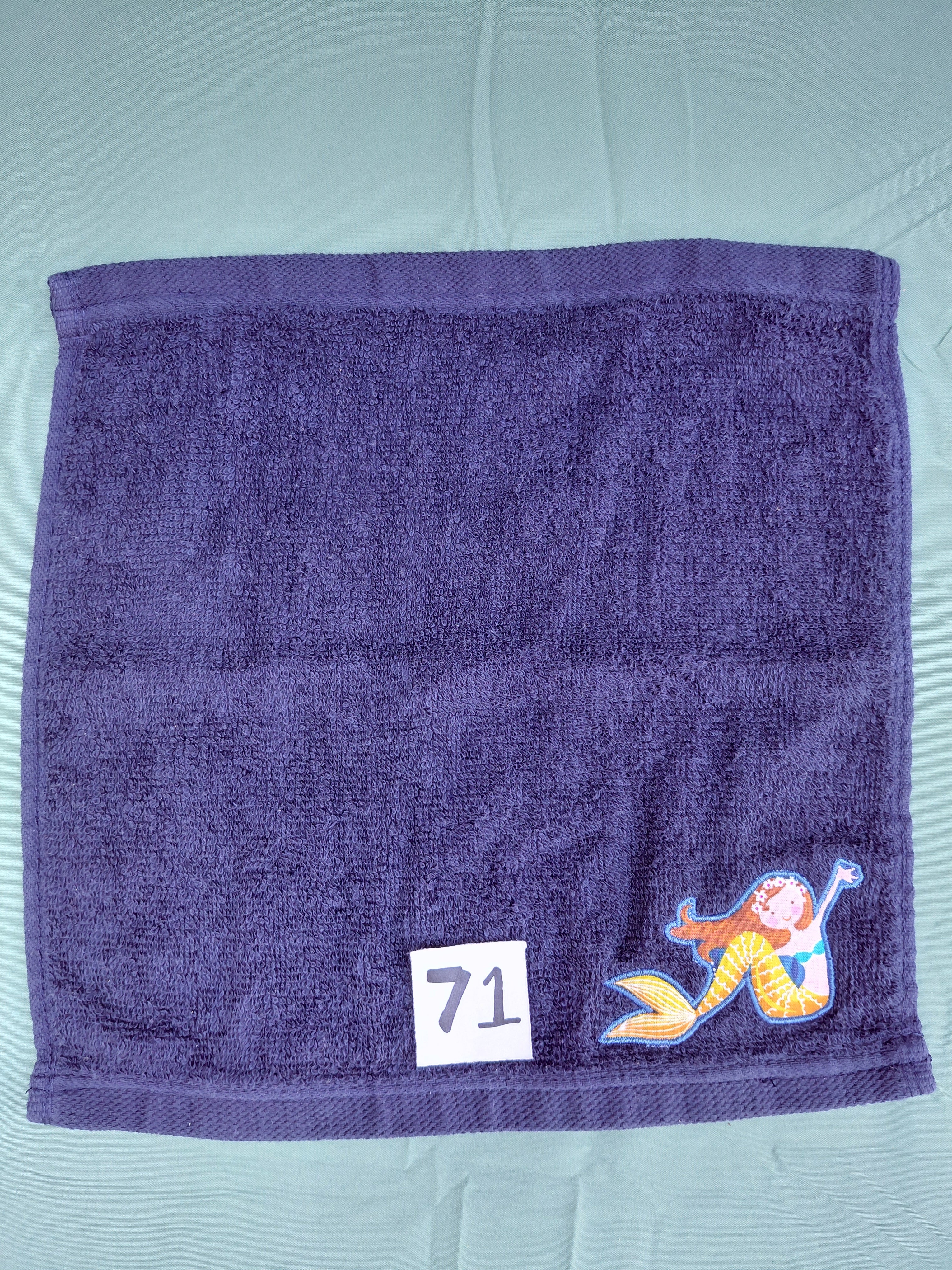 Dark blue handcrafted embellished washcloth with mermaid appliqué, reinforced hem